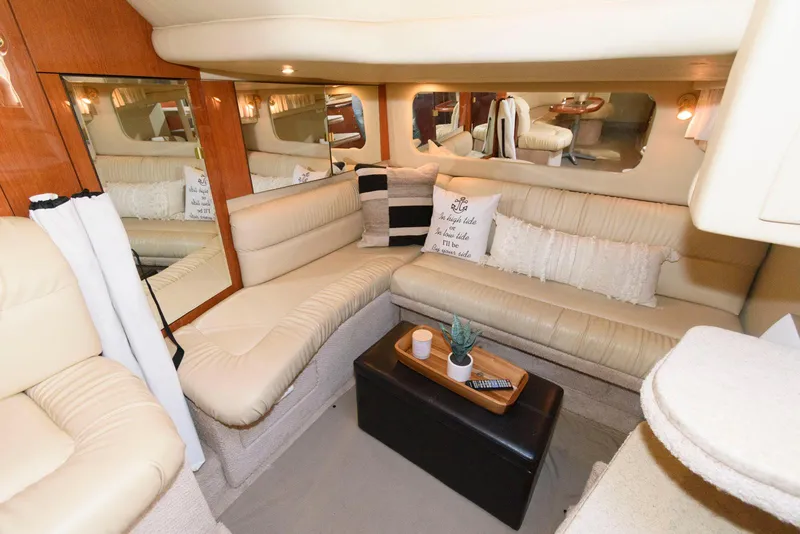 Slide: The Image of Luxurious interior of 2000 Sea Ray 380 Sundancer yacht with beige seating and decor. - 20
