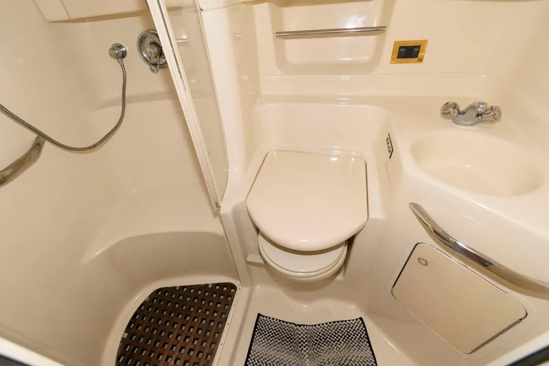 Slide: The Image of Compact bathroom in 2000 Sea Ray 380 Sundancer yacht with shower and toilet. - 21