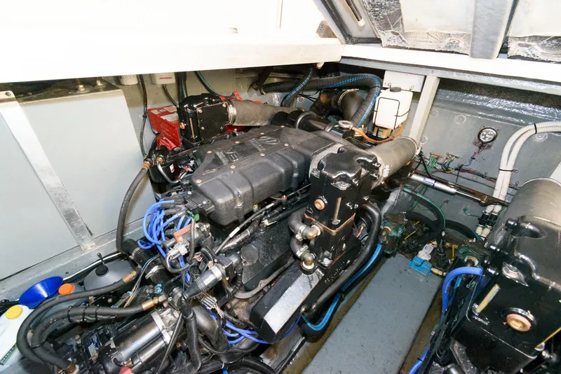 Slide: The Image of Engine room of 2000 Sea Ray 380 Sundancer with visible components and wiring. - 23