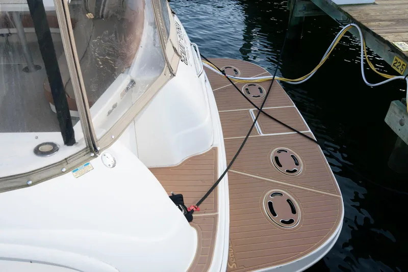 Slide: The Image of Sea Ray 380 Sundancer 2000 model docked with swim platform and mooring lines. - 3