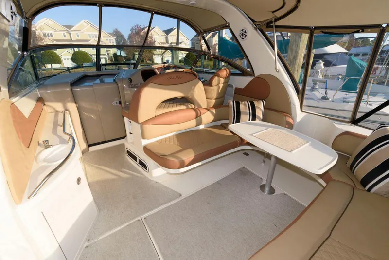 Slide: The Image of Luxurious interior of 2000 Sea Ray 380 Sundancer yacht with plush seating and table. - 6