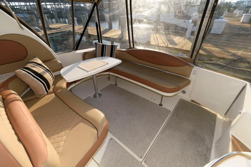 Slide: The Image of Interior of 2000 Sea Ray 380 Sundancer with seating and table. - 7