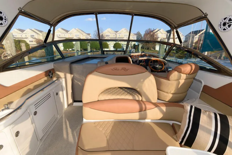 Slide: The Image of Interior of 2000 Sea Ray 380 Sundancer yacht with tan leather seating and panoramic windows. - 8