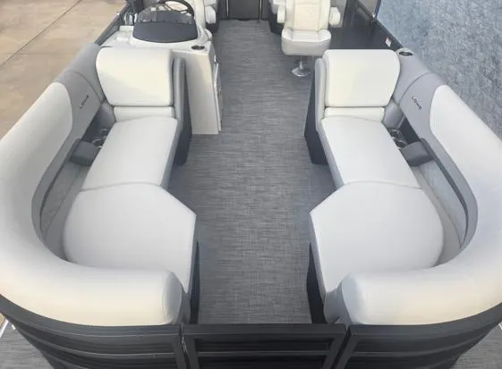 Slide: The Image of 2025 Lowe SS 230 WV pontoon boat with spacious seating and modern design. - 3