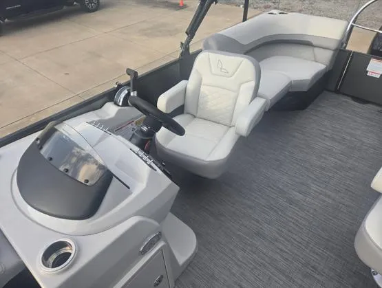 Slide: The Image of 2025 Lowe SS 230 WV boat interior with modern seating and steering console. - 4