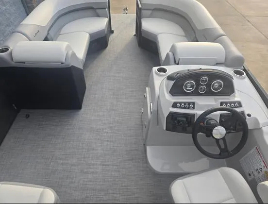 Slide: The Image of 2025 Lowe SS 230 WV pontoon boat interior with modern seating and dashboard. - 6