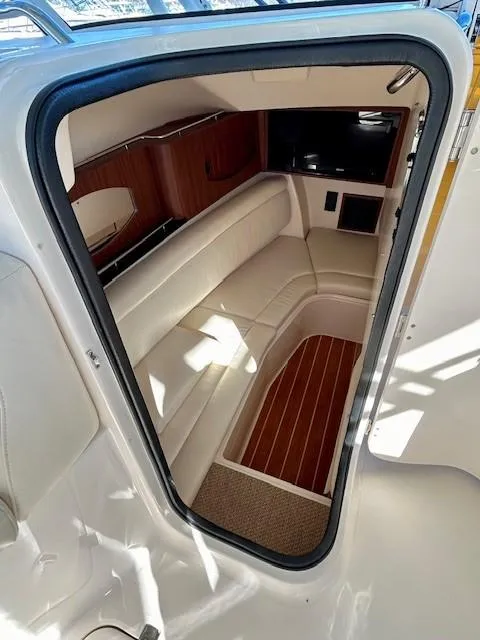 Slide: The Image of Interior view of 2022 Grady-White Freedom 335 boat, featuring elegant seating and wood accents. - 19