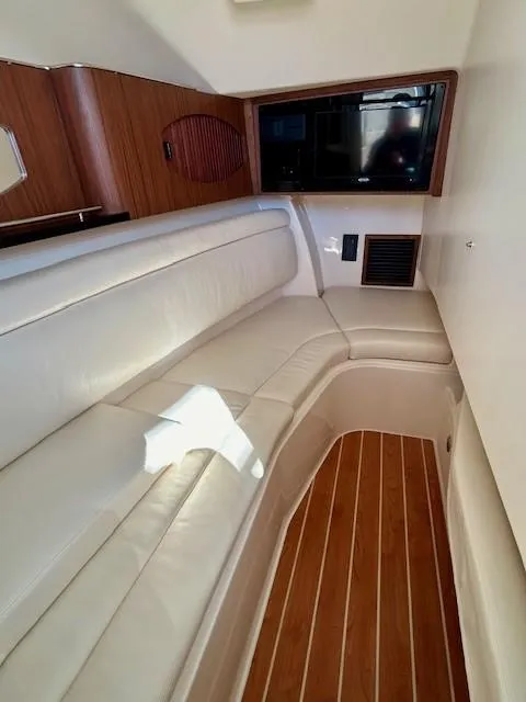 Slide: The Image of Interior of 2022 Grady-White Freedom 335 boat with leather seating and wood flooring. - 20