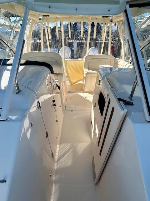 Slide: The Image of 2022 Grady-White Freedom 335 boat interior with seating and helm area. - 25