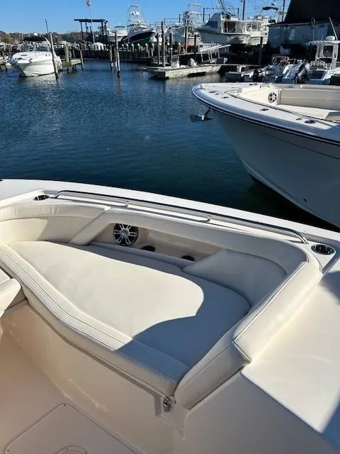 Slide: The Image of 2022 Grady-White Freedom 335 boat with spacious seating at a marina. - 28