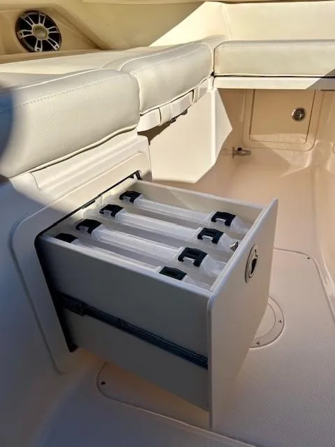 Slide: The Image of 2022 Grady-White Freedom 335 boat storage compartment with pull-out drawers. - 32