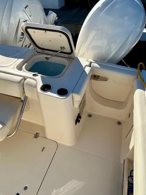 Slide: The Image of 2022 Grady-White Freedom 335 boat interior with open storage compartment. - 33