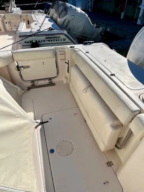 Slide: The Image of 2022 Grady-White Freedom 335 boat interior with seating and storage. - 35