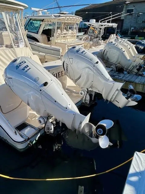 Slide: The Image of 2022 Grady-White Freedom 335 boats with powerful outboard engines docked in a marina. - 38