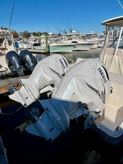 Slide: The Image of 2022 Grady-White Freedom 335 boat with Yamaha outboard engines at a marina. - 39