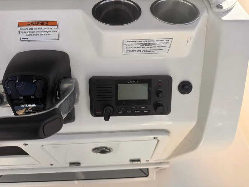 Slide: The Image of 2020 Cobia 262 Center Console dashboard with Yamaha controls and Garmin radio. - 16