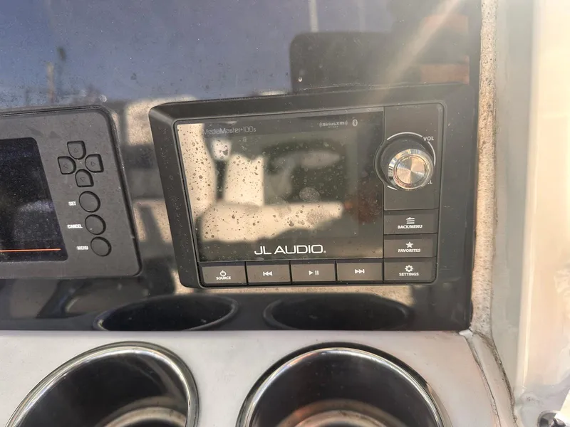 Slide: The Image of JL Audio system on 2020 Cobia 262 Center Console boat dashboard. - 17