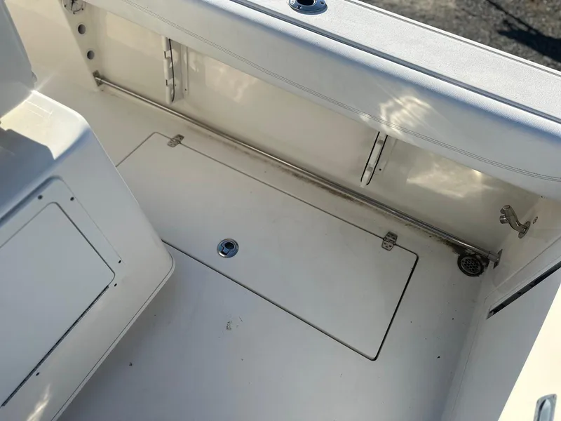 Slide: The Image of 2020 Cobia 262 Center Console boat interior with storage compartment. - 20