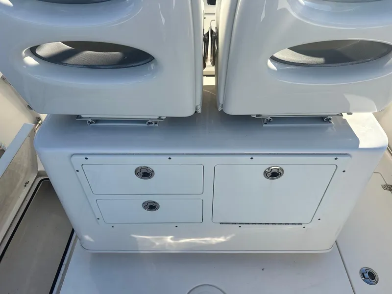 Slide: The Image of 2020 Cobia 262 Center Console boat seating and storage compartments. - 21