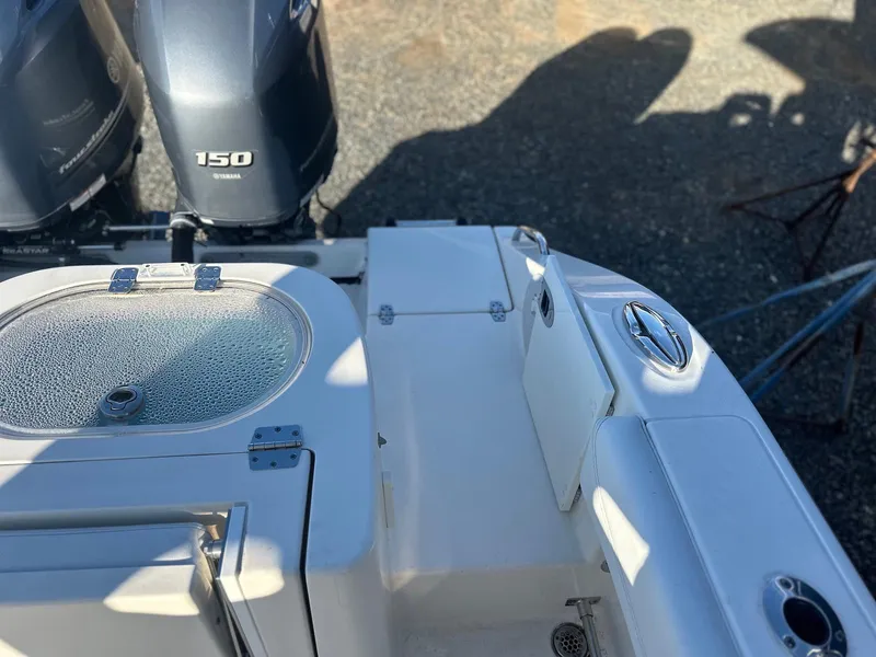 Slide: The Image of 2020 Cobia 262 Center Console boat with dual 150 horsepower engines. - 22