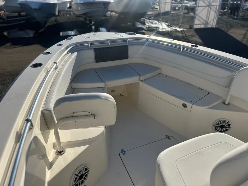 Slide: The Image of 2020 Cobia 262 Center Console boat interior with cushioned seating and storage. - 7