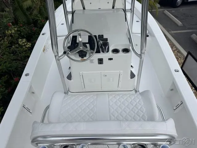 Slide: The Image of 2025 BlackJack 224 boat interior with steering console and seating. - 18