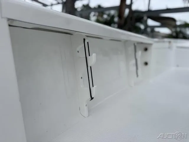 Slide: The Image of Close-up of 2025 BlackJack 224 boat interior detail, showcasing sleek white design. - 19