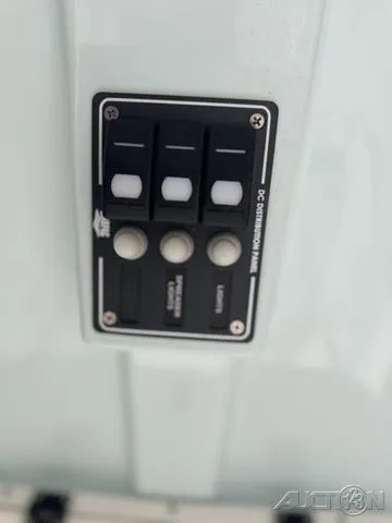 Slide: The Image of Control panel of BlackJack 224 boat, 2025 model, featuring switches and buttons. - 21