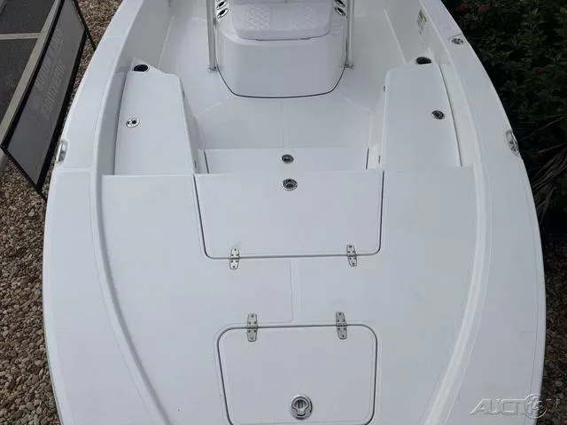 Slide: The Image of 2025 BlackJack 224 boat deck with storage compartments and seating. - 26