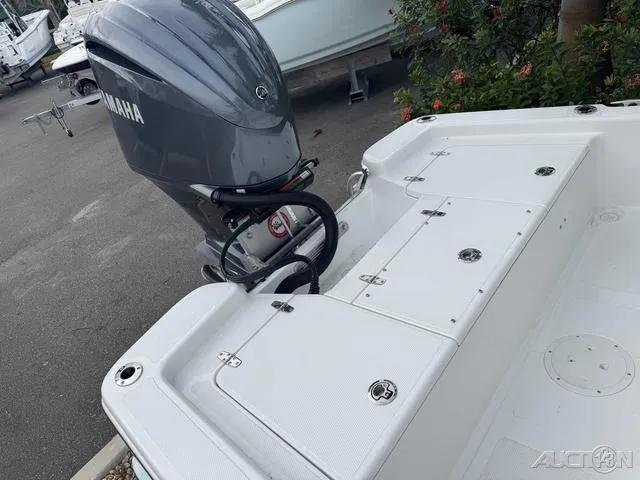 Slide: The Image of BlackJack 224 boat with Yamaha outboard motor, 2025 model, docked near greenery. - 35