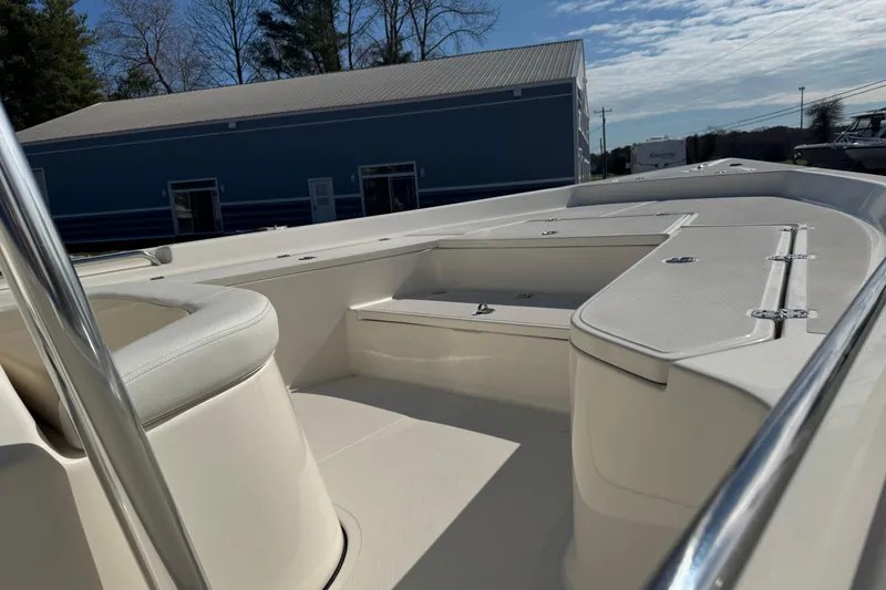 Slide: The Image of 2026 Bulls Bay 2400 boat interior with seating and storage compartments. - 12