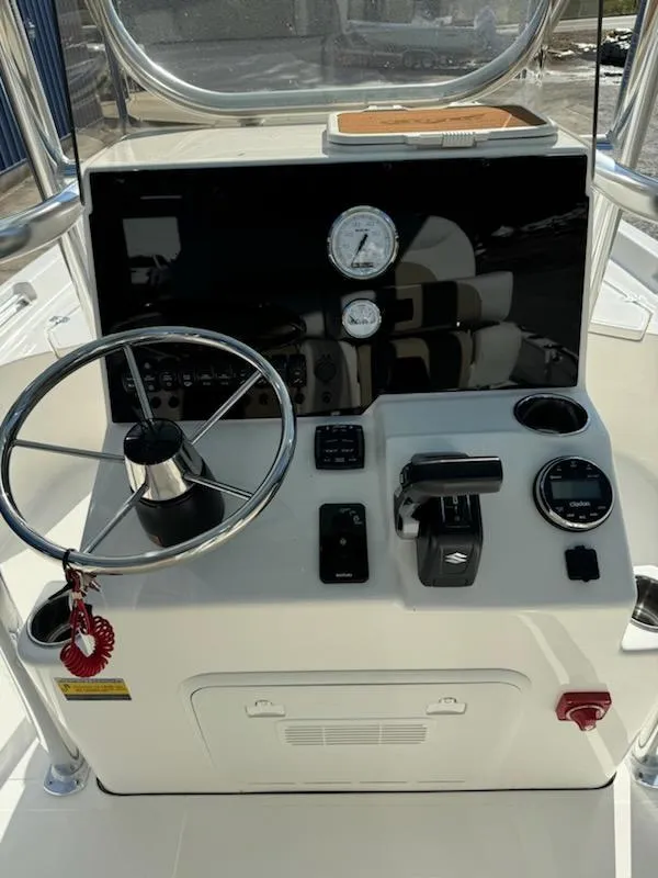 Slide: The Image of Bulls Bay 2400 boat console with steering wheel and controls, 2025 model. - 3