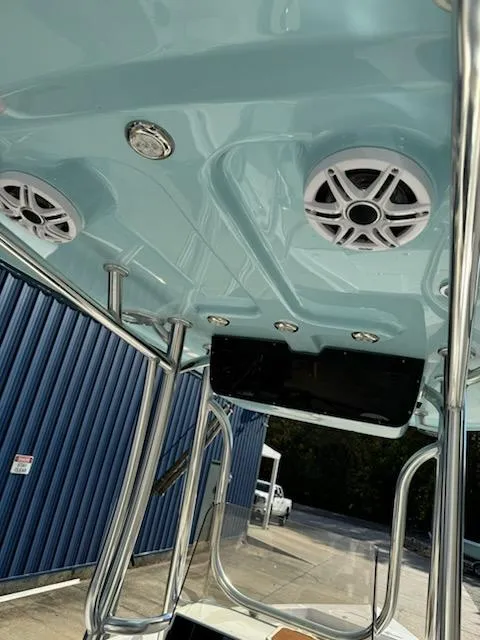 Slide: The Image of 2025 Bulls Bay 2400 boat with speakers and stainless steel frame. - 6