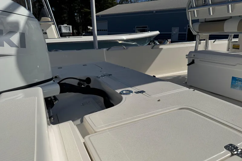 Slide: The Image of 2026 Bulls Bay 2400 boat interior with seating and storage compartments. - 9