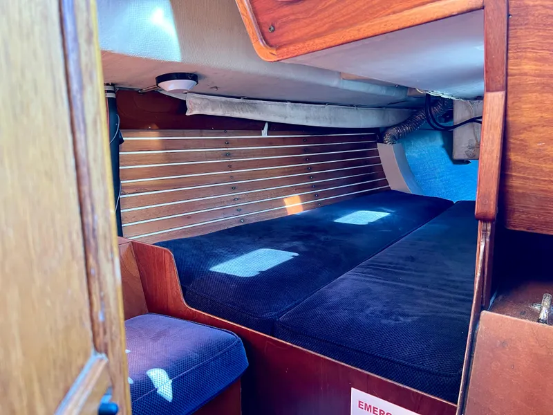 Slide: The Image of Interior cabin of a 1985 Santa Cruz 50 sailboat with wooden paneling. - 14
