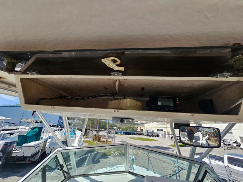 Slide: The Image of 1985 Grady-White 228 Seafarer boat interior storage compartment with equipment. - 21