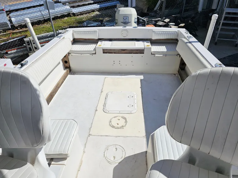 Slide: The Image of 1985 Grady-White 228 Seafarer boat interior with white seating and spacious deck. - 24