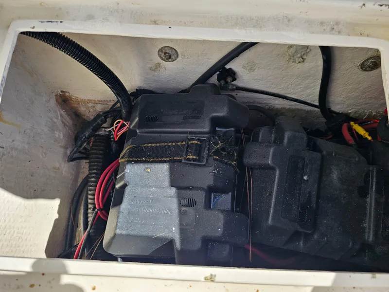 Slide: The Image of 1985 Grady-White 228 SEAFARER engine compartment with wiring and components. - 30