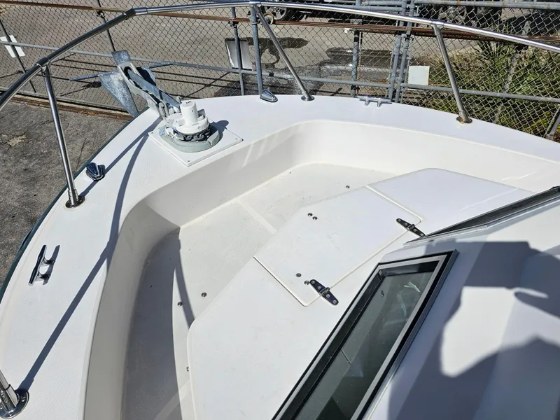 Slide: The Image of 1985 Grady-White 228 Seafarer boat deck with anchor and railing. - 31
