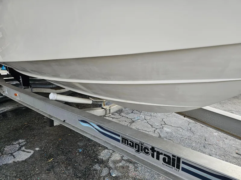 Slide: The Image of 1985 Grady-White 228 Seafarer boat on Magic Trail trailer, close-up view. - 9