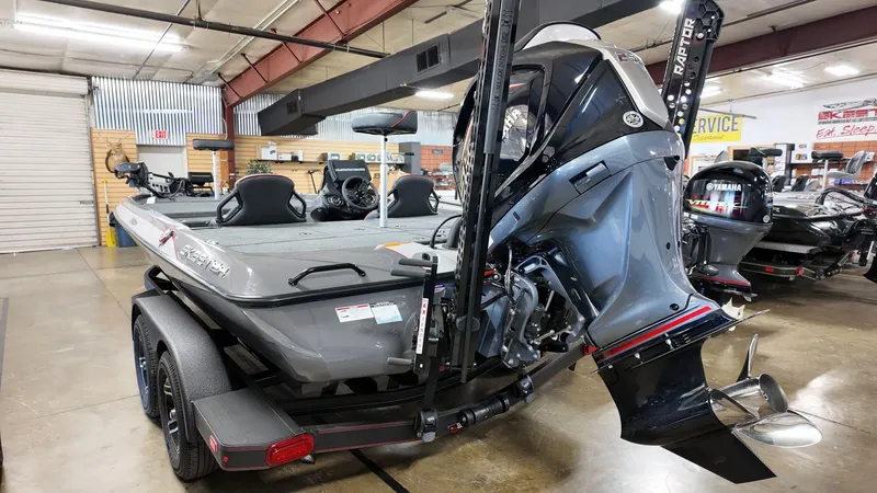 Slide: The Image of 2025 Skeeter ZXR 21 bass boat in showroom, featuring powerful outboard motor. - 3
