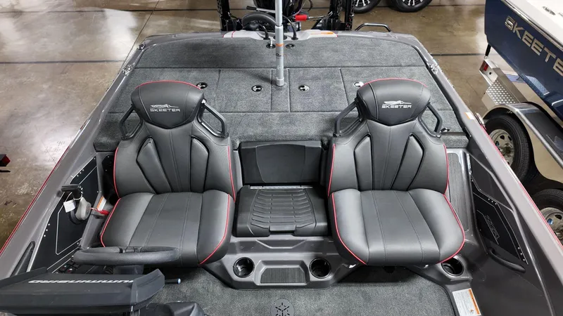 Slide: The Image of 2025 Skeeter ZXR 21 boat interior with two sleek, gray seats and modern design. - 7