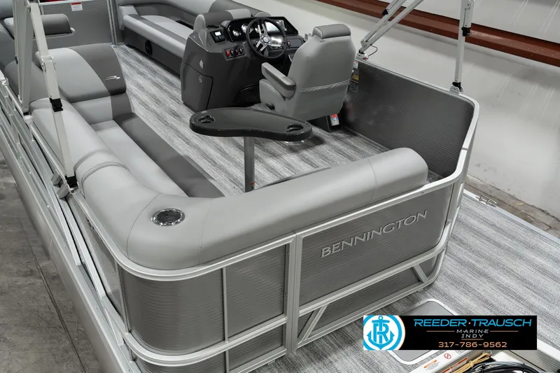 Slide: The Image of 2025 Bennington 22 SLSE pontoon boat interior with gray seating and modern helm. - 12