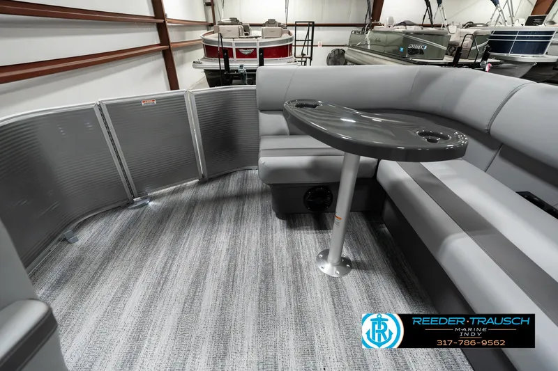 Slide: The Image of 2025 Bennington 22 SLSE pontoon boat interior with gray seating and table. - 14