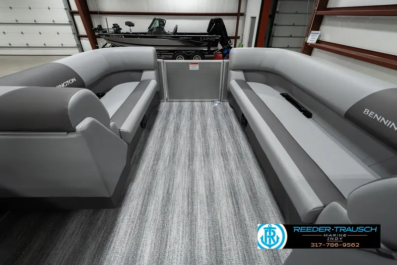 Slide: The Image of 2025 Bennington 22 SLSE pontoon boat interior with gray seating and carpet flooring. - 18