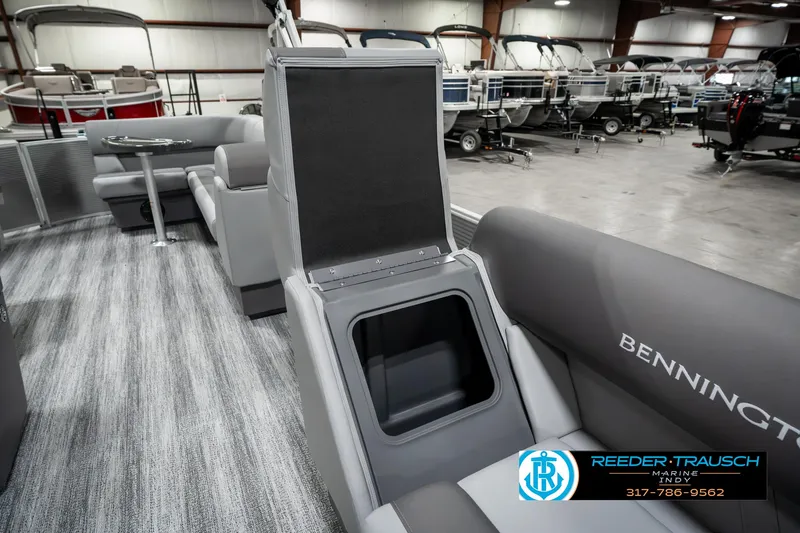 Slide: The Image of 2025 Bennington 22 SLSE boat interior with storage compartment and seating. - 21