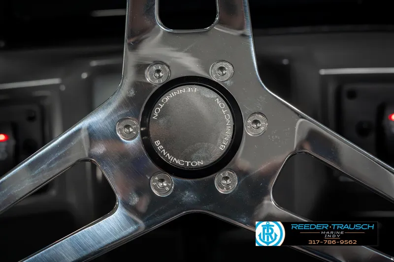 Slide: The Image of Close-up of 2025 Bennington 22 SLSE steering wheel with logo. - 29