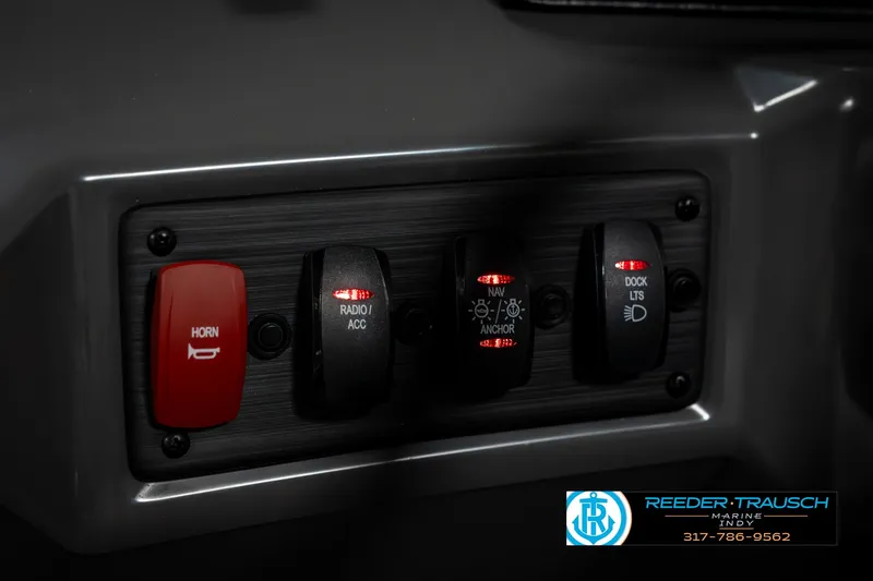Slide: The Image of Control panel of 2025 Bennington 22 SLSE boat with switches and horn button. - 31