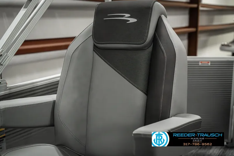 Slide: The Image of 2025 Bennington 22 SLSE boat seat, gray and black design, Reeder-Trausch logo visible. - 37