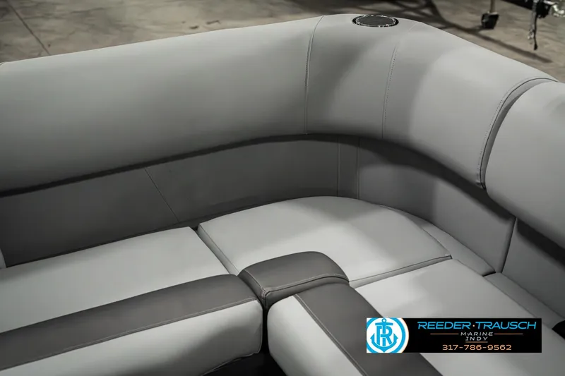 Slide: The Image of 2025 Bennington 22 SLSE boat interior with gray seating and Reeder-Trausch Marine logo. - 39